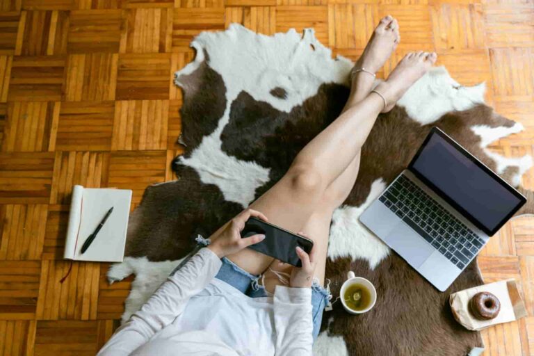 lady sitting on a cowhide rug