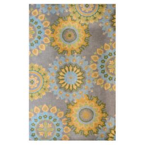 Grey hand-tufted wool rug with mandala-style floral circles in sage and blue