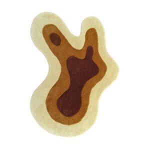 FiRugs Halo luxury hand-tufted rug featuring an uneven non-rectilinear puddle shape with an organic biophilic outline and concentric wavy layers in cream, caramel mustard, and a chocolate brown center, handcrafted in Varanasi, India from 100 percent New Zealand wool.
