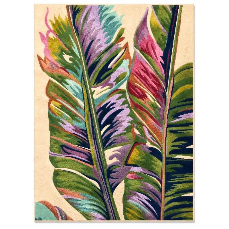 FiRugs Sway luxury hand-tufted rug in 100 percent New Zealand wool featuring an ivory background with oversized abstract tropical banana leaves in emerald green, purple, and magenta, crafted in Varanasi, India.
