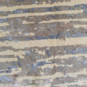 Close-up of the Strata hand-tufted New Zealand wool and viscose rug highlighting its layered linear texture and handcrafted premium finish by FiRugs.
